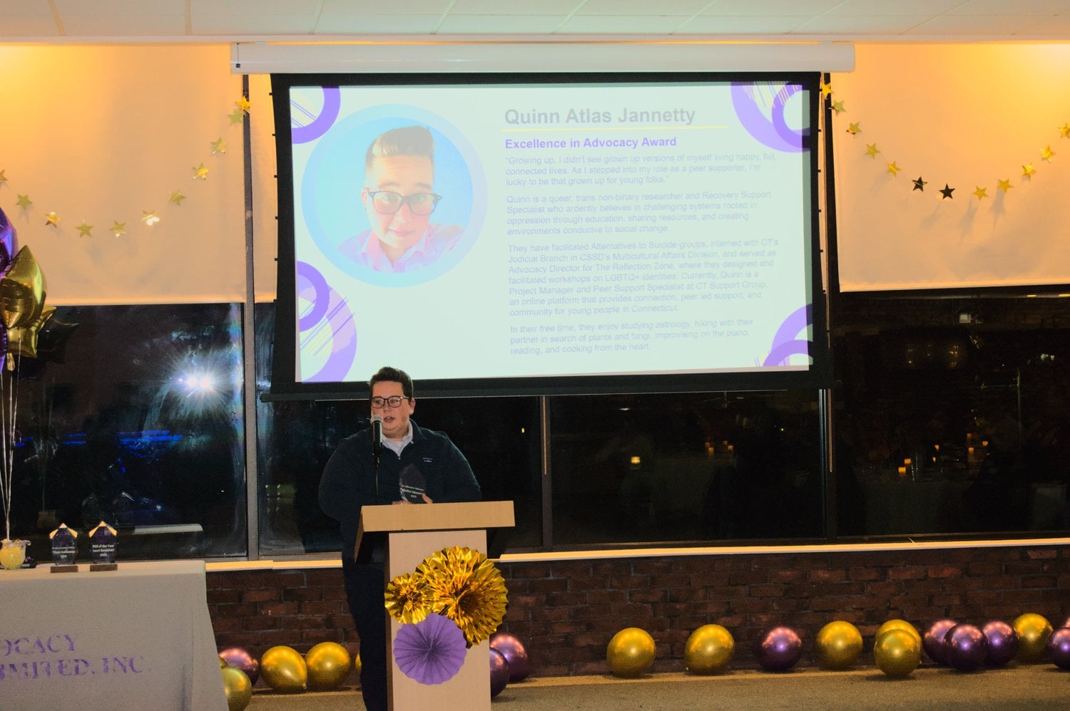 Quinn gives their acceptance speech at AU's annual award ceremony. for the Dr. Karen Kangas Award for Excellence in Advocacy.