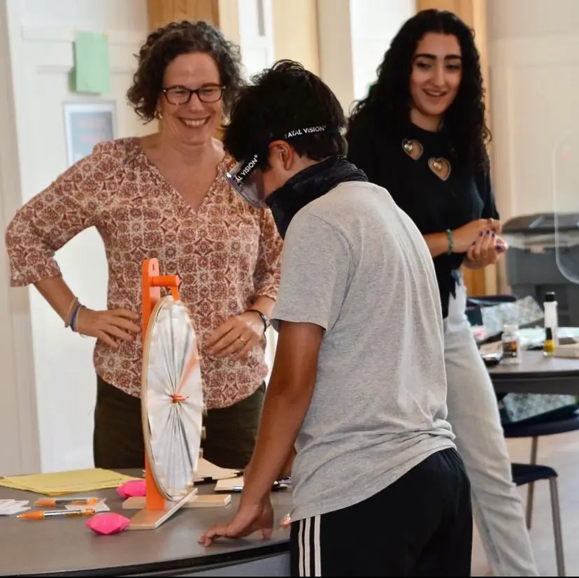 Positive Directions staff member with a student